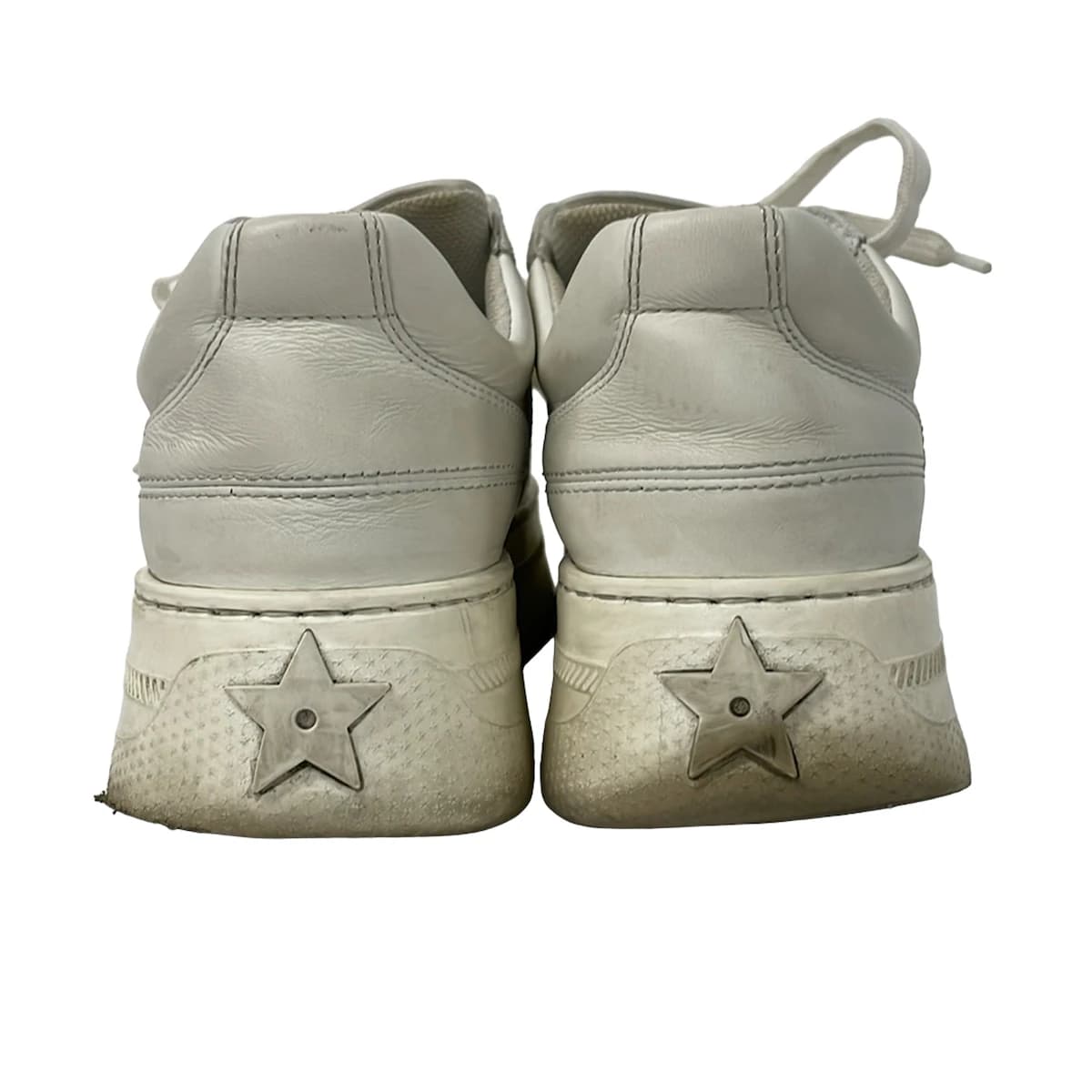 Pair of low-top trainers photographed against a plain background.