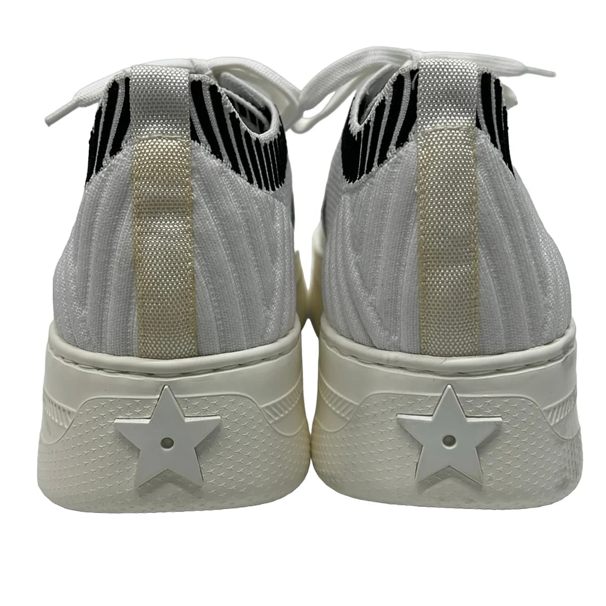 Pair of women's low-top sneakers photographed together.
