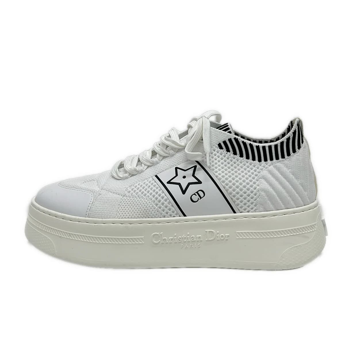 Pair of women's low-top sneakers photographed together.