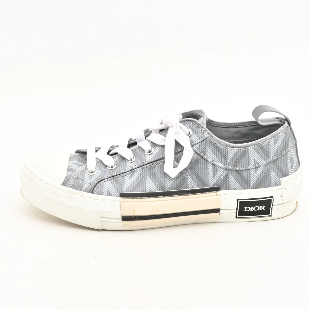 Pair of low-top trainers in grey with white panels and sole, shown from the side.