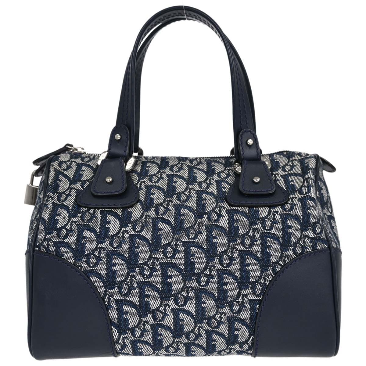 Navy monogram-patterned canvas handbag with leather trim and a small padlock.