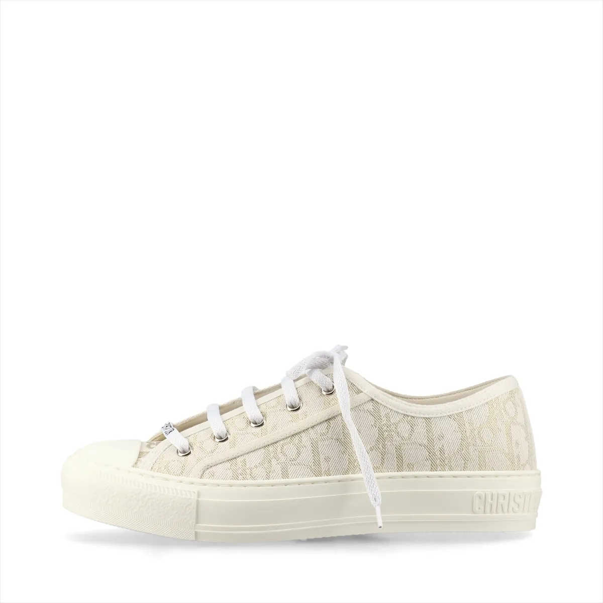 Low-top fabric sneakers with all-over monogram-style pattern in white and gold tones.