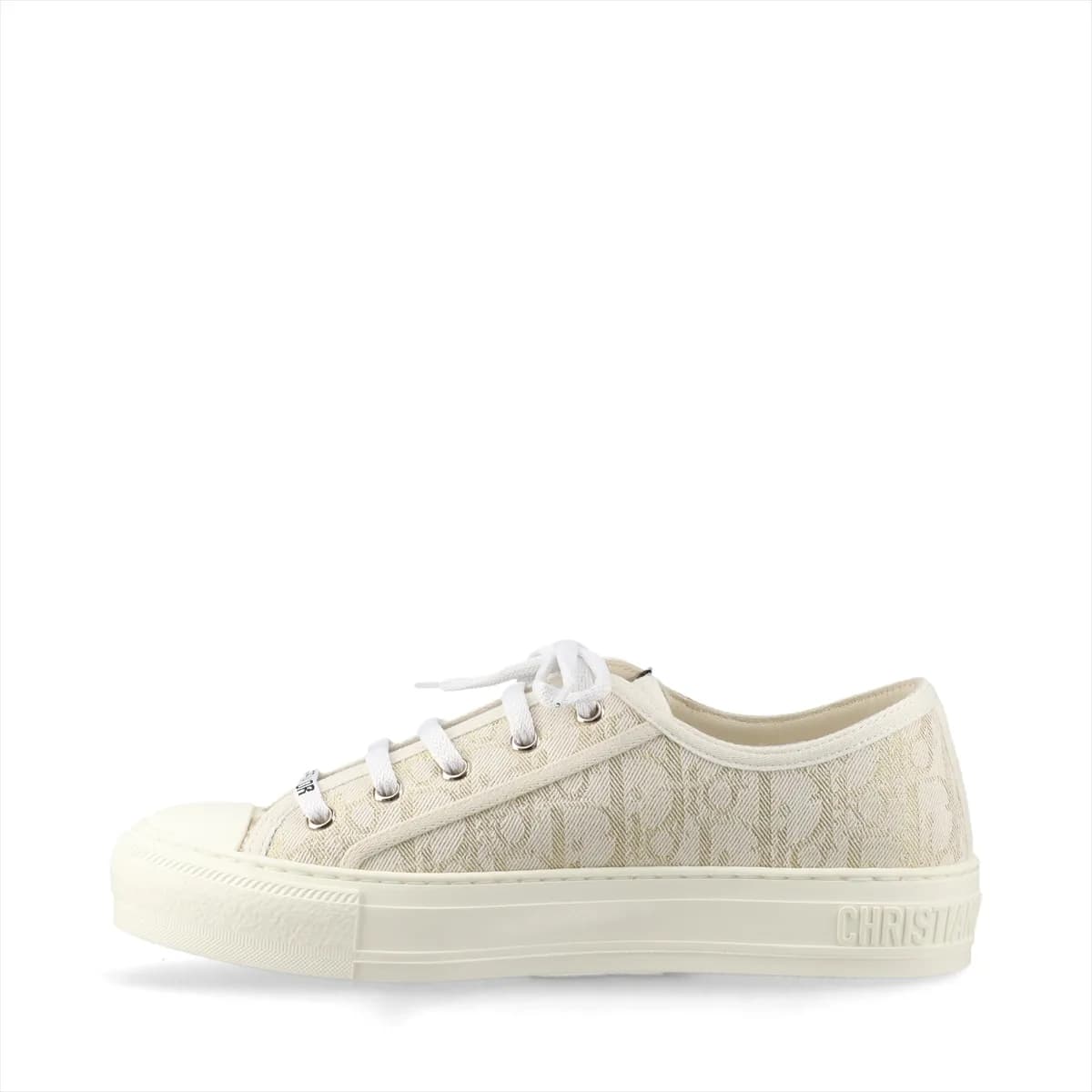 Low-top fabric sneakers with all-over monogram-style pattern in white and gold tones.