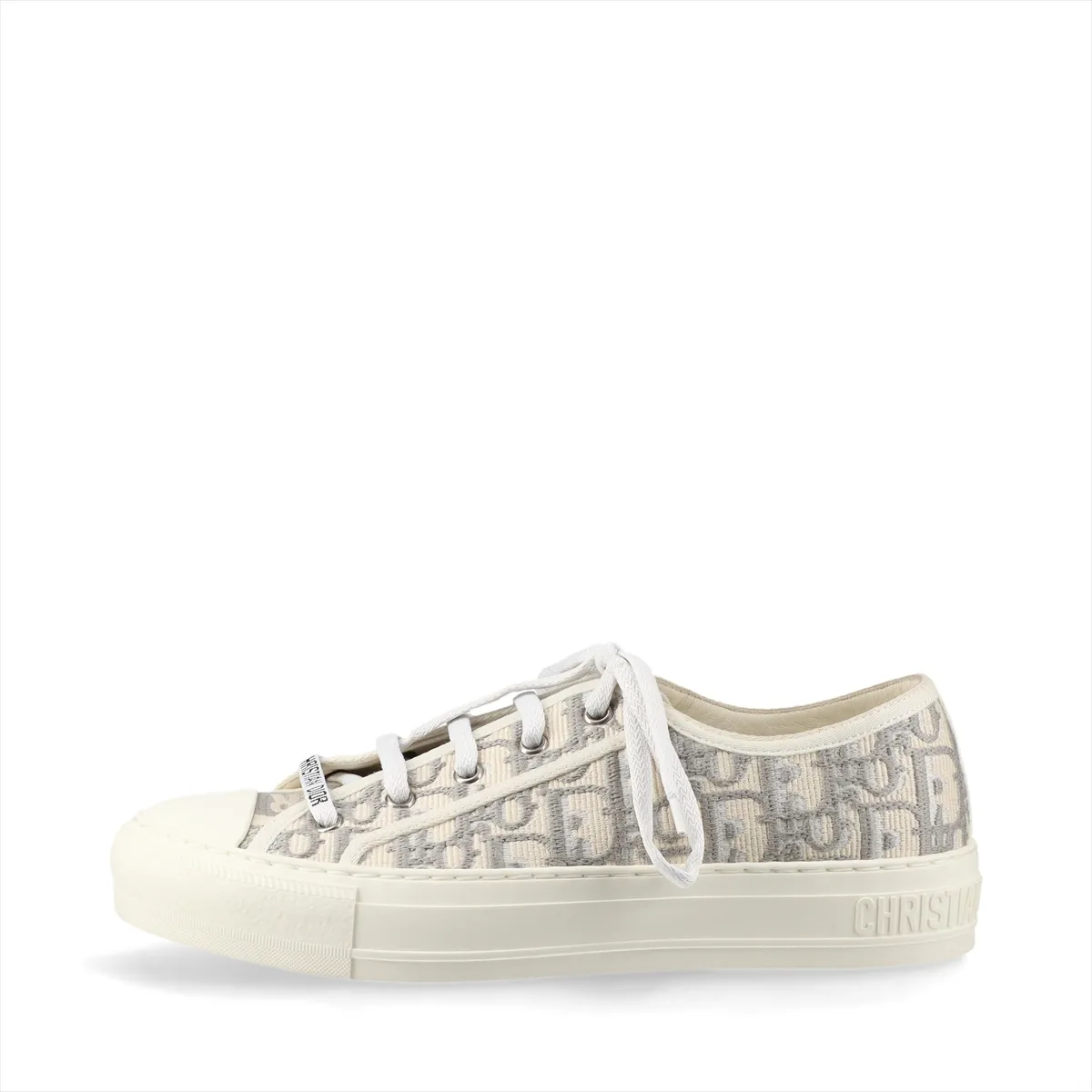 Pair of grey and white patterned fabric sneakers with white rubber soles