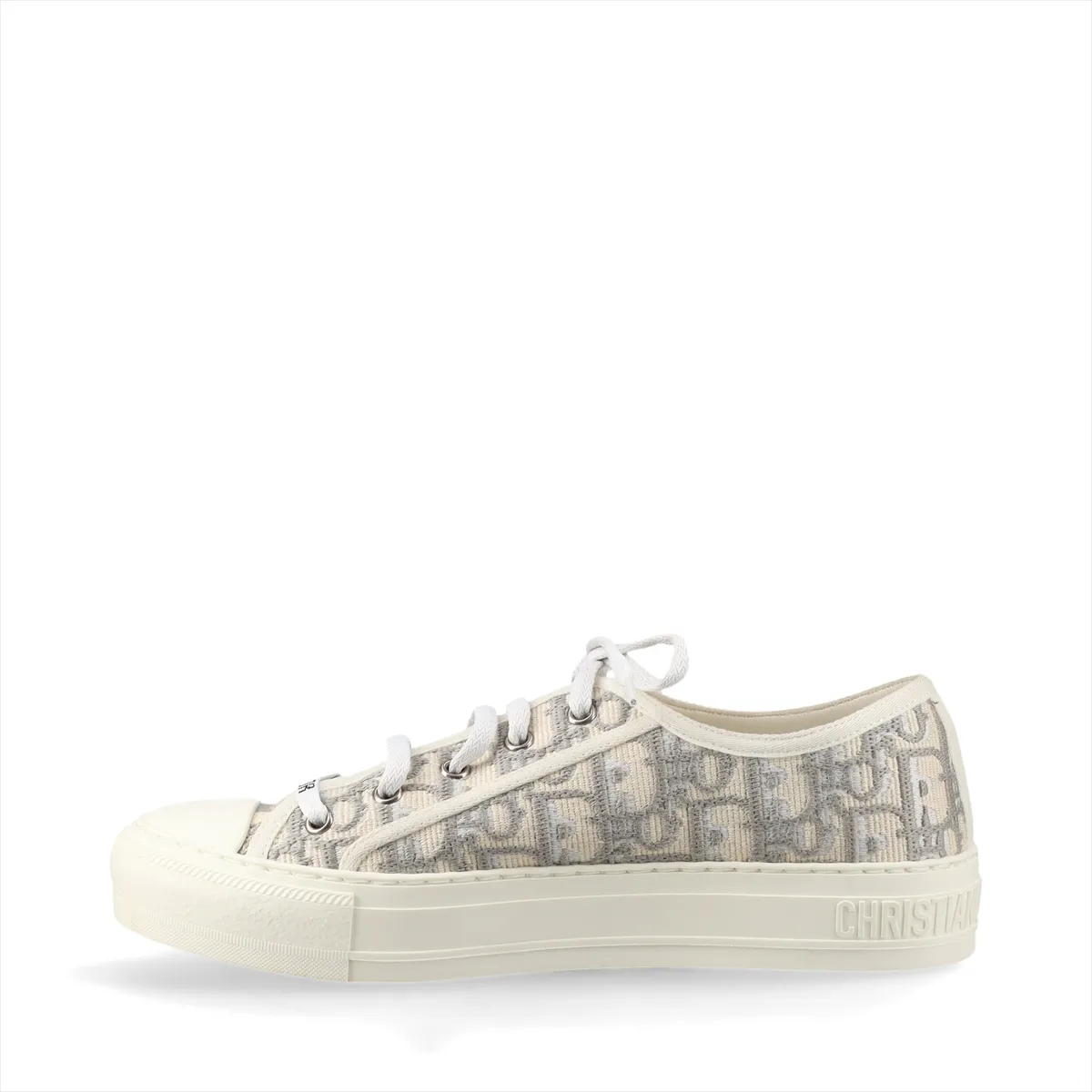 Pair of grey and white patterned fabric sneakers with white rubber soles