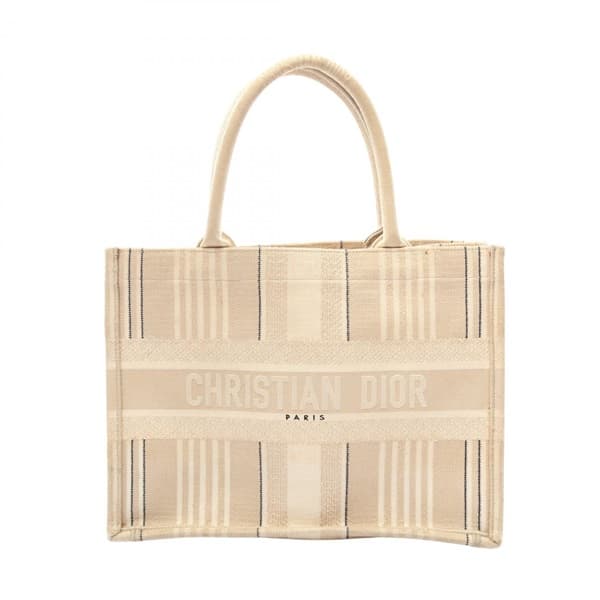 Large flat canvas tote with embroidered patterning and two long top handles.