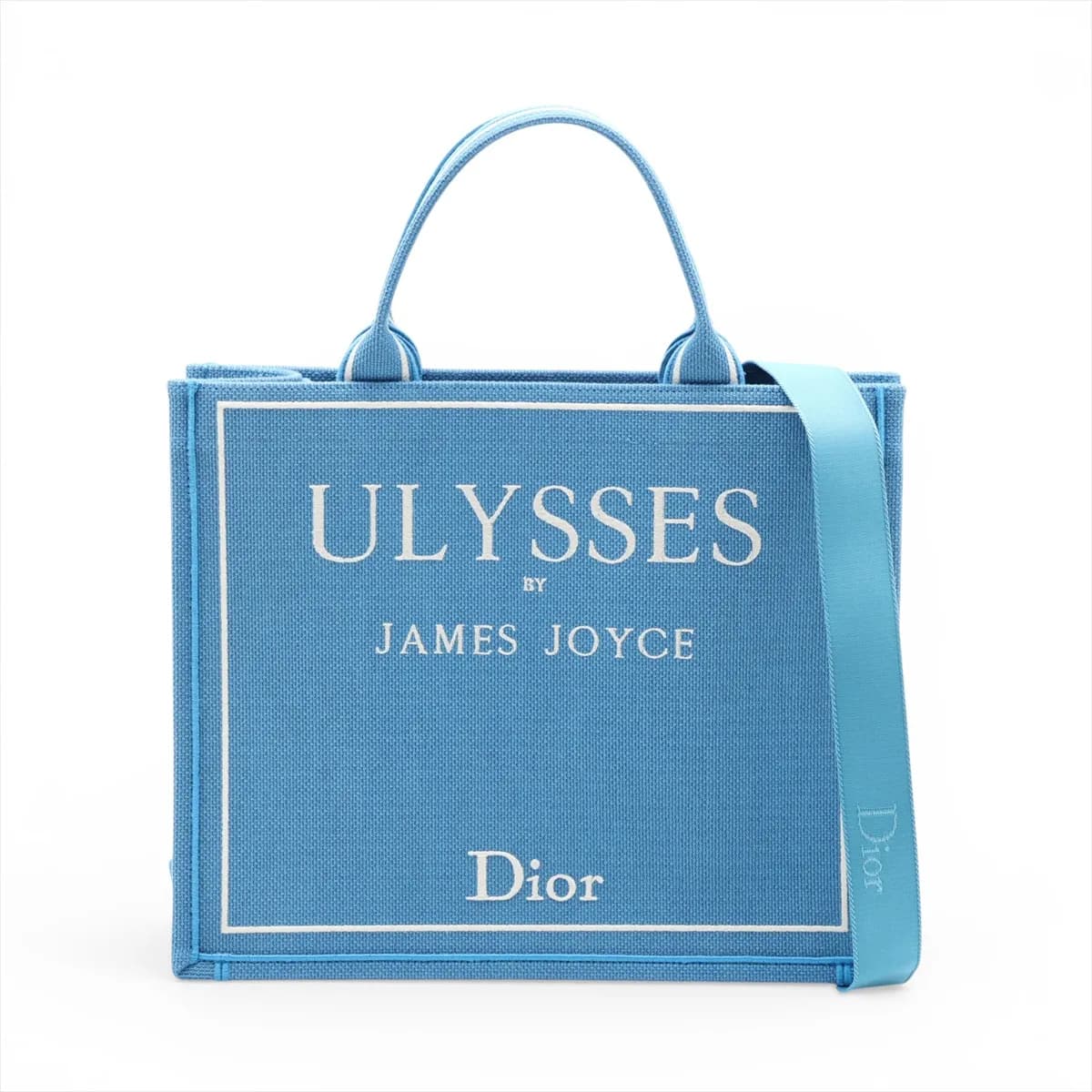 Blue and white patterned canvas tote with star motifs and flat top handles.
