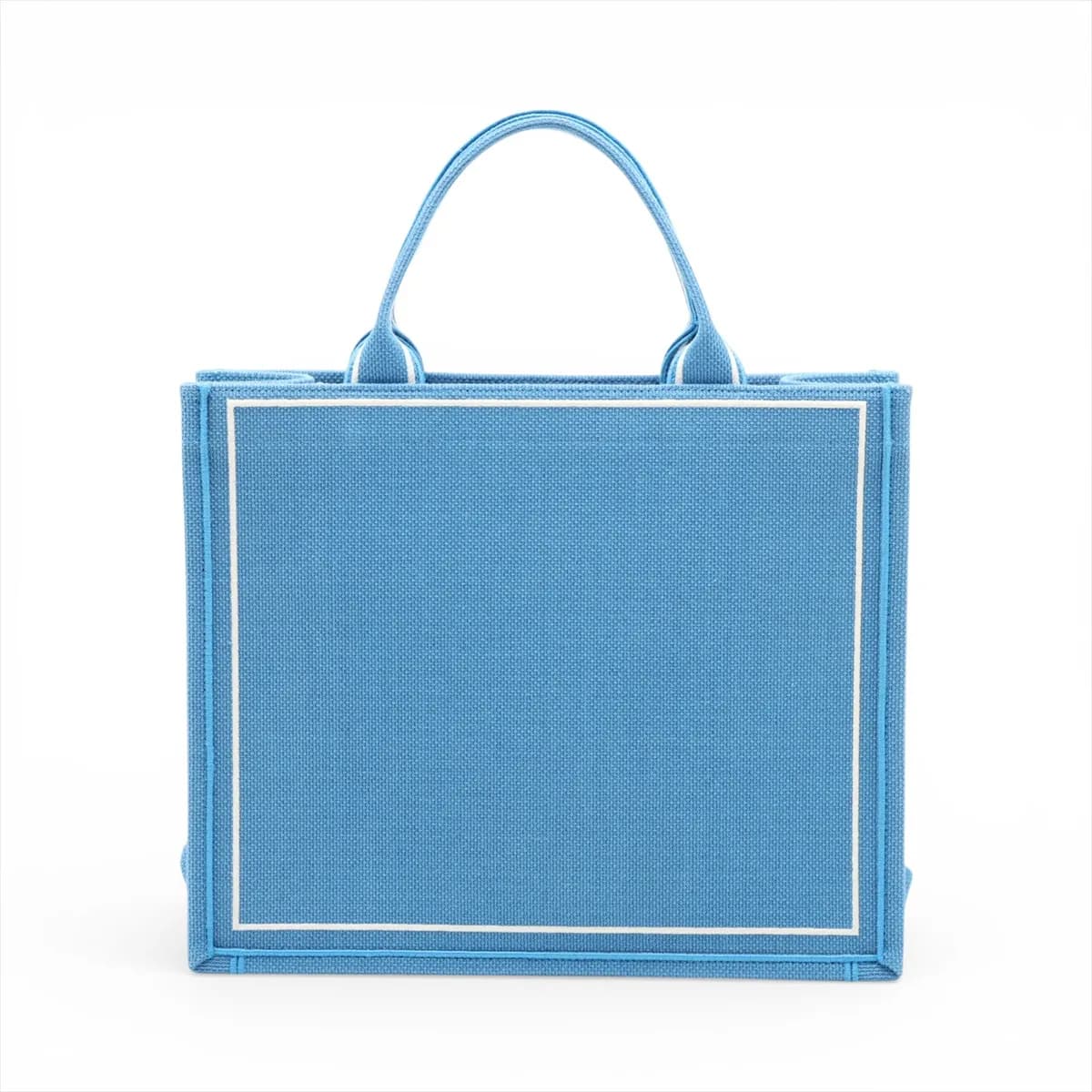 Blue and white patterned canvas tote with star motifs and flat top handles.