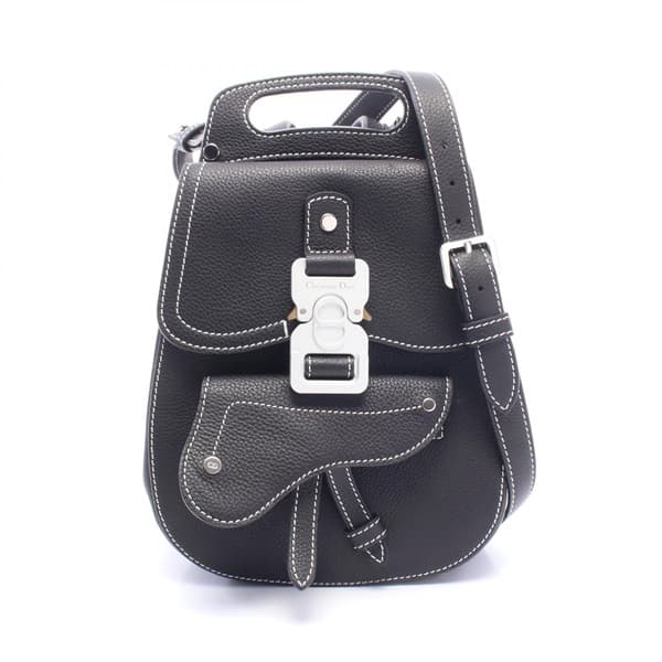 Black backpack with padded straps and a front flap pocket, shown upright.