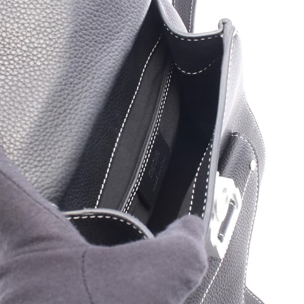 Black backpack with padded straps and a front flap pocket, shown upright.