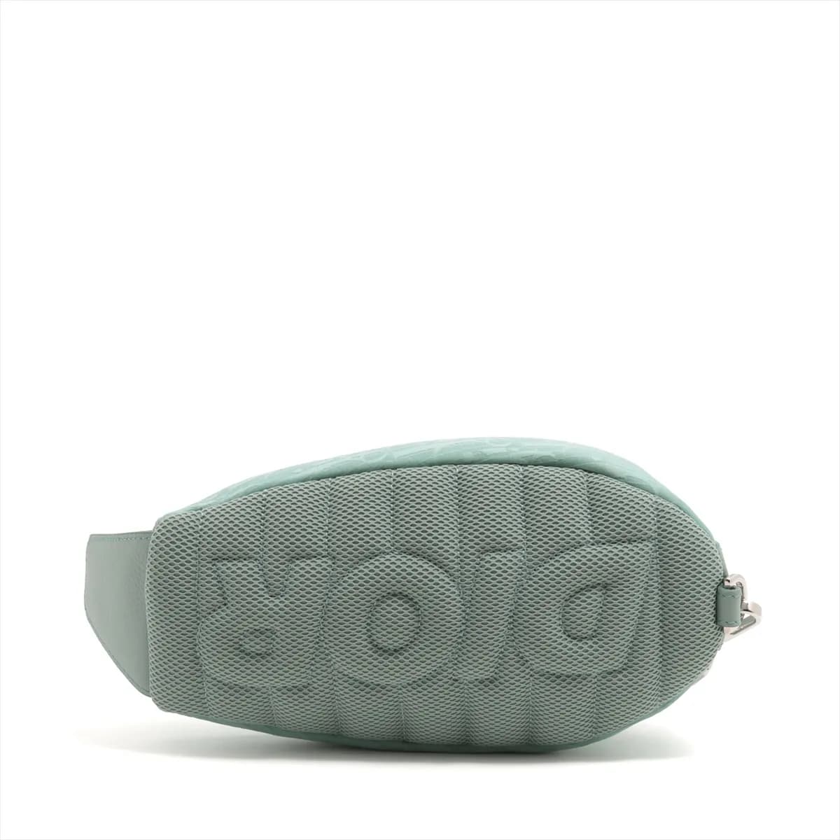 Green patterned nylon body bag with dark leather trim and a wide adjustable strap.