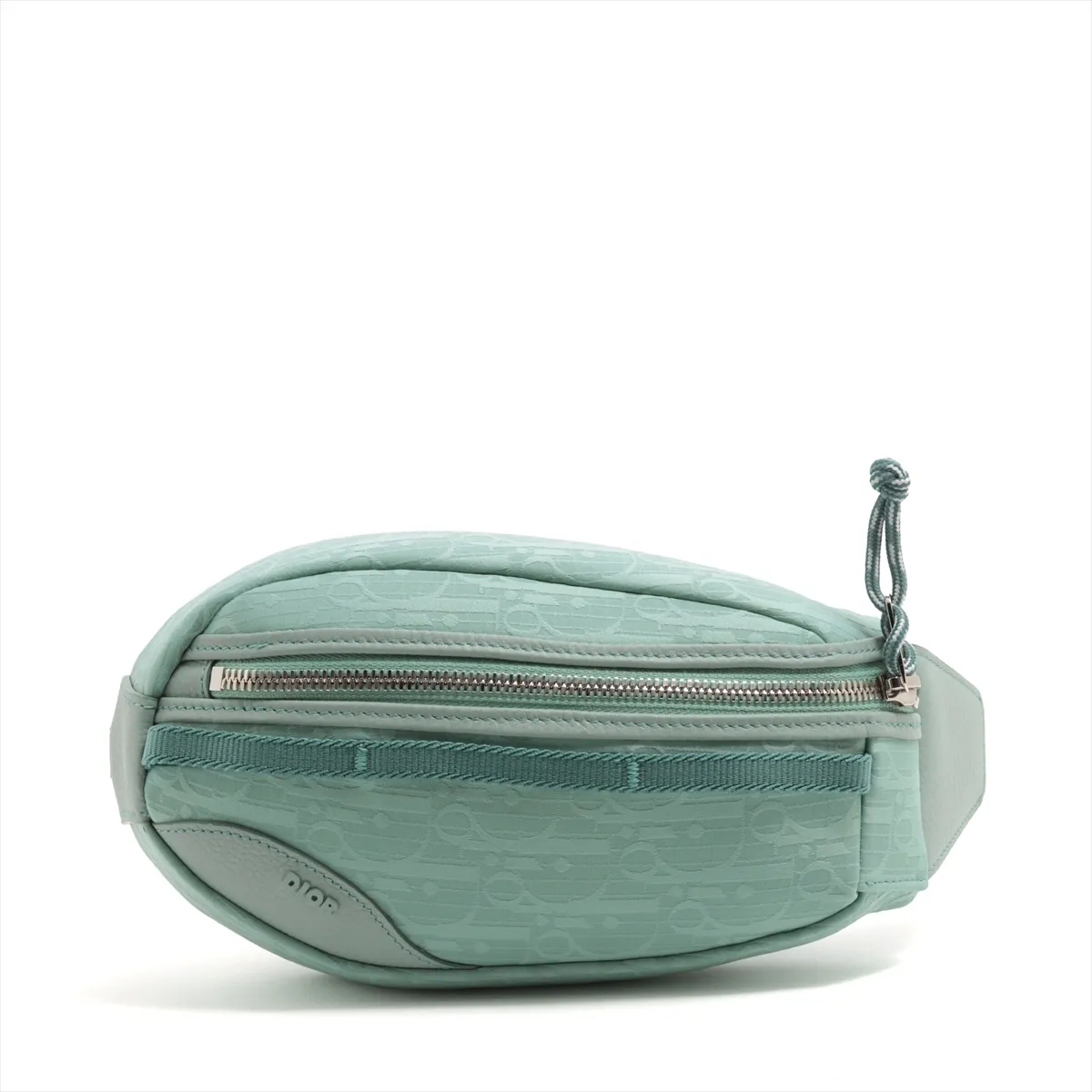 Green patterned nylon body bag with dark leather trim and a wide adjustable strap.
