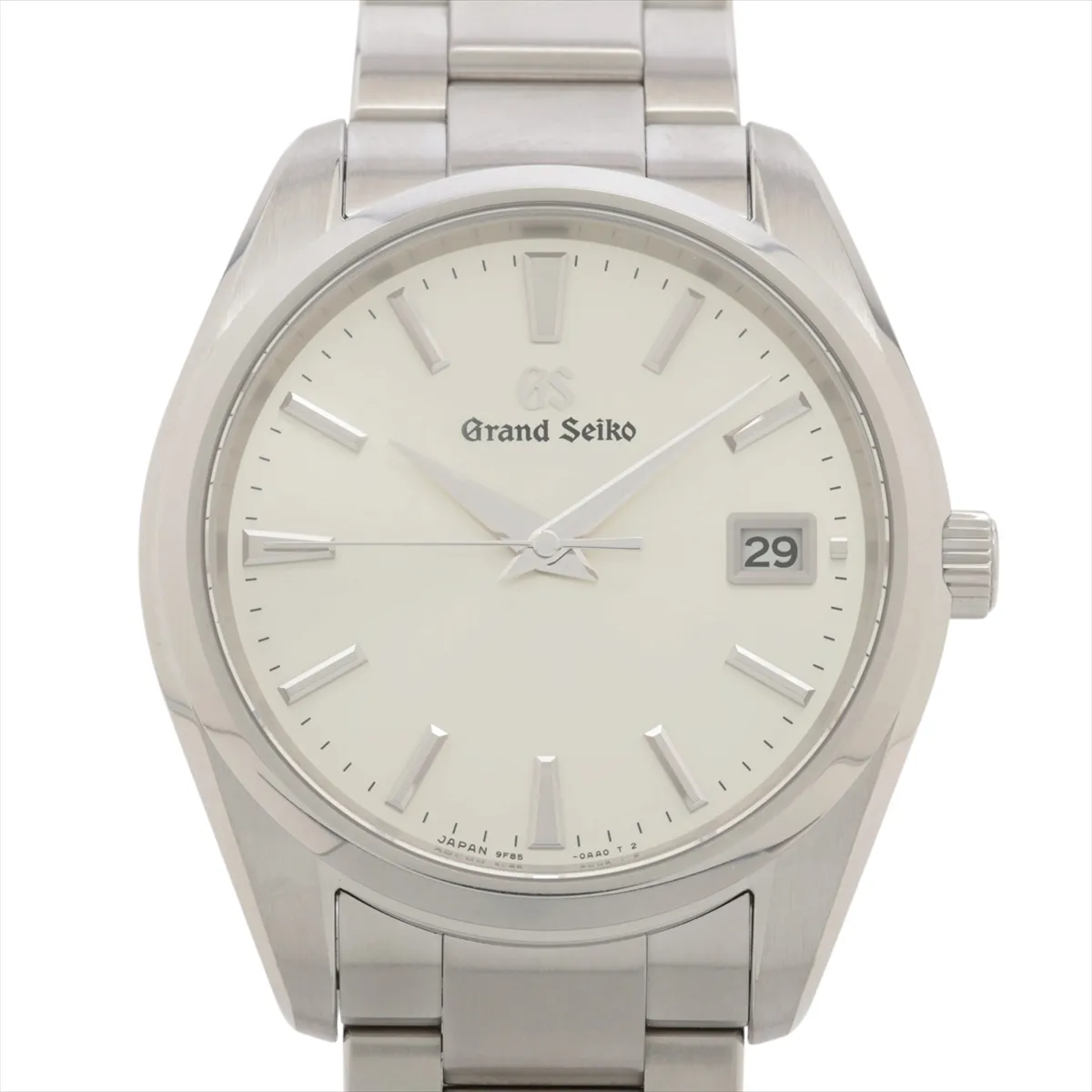 Polished steel watch with bright silver dial, sharp faceted markers and integrated bracelet.