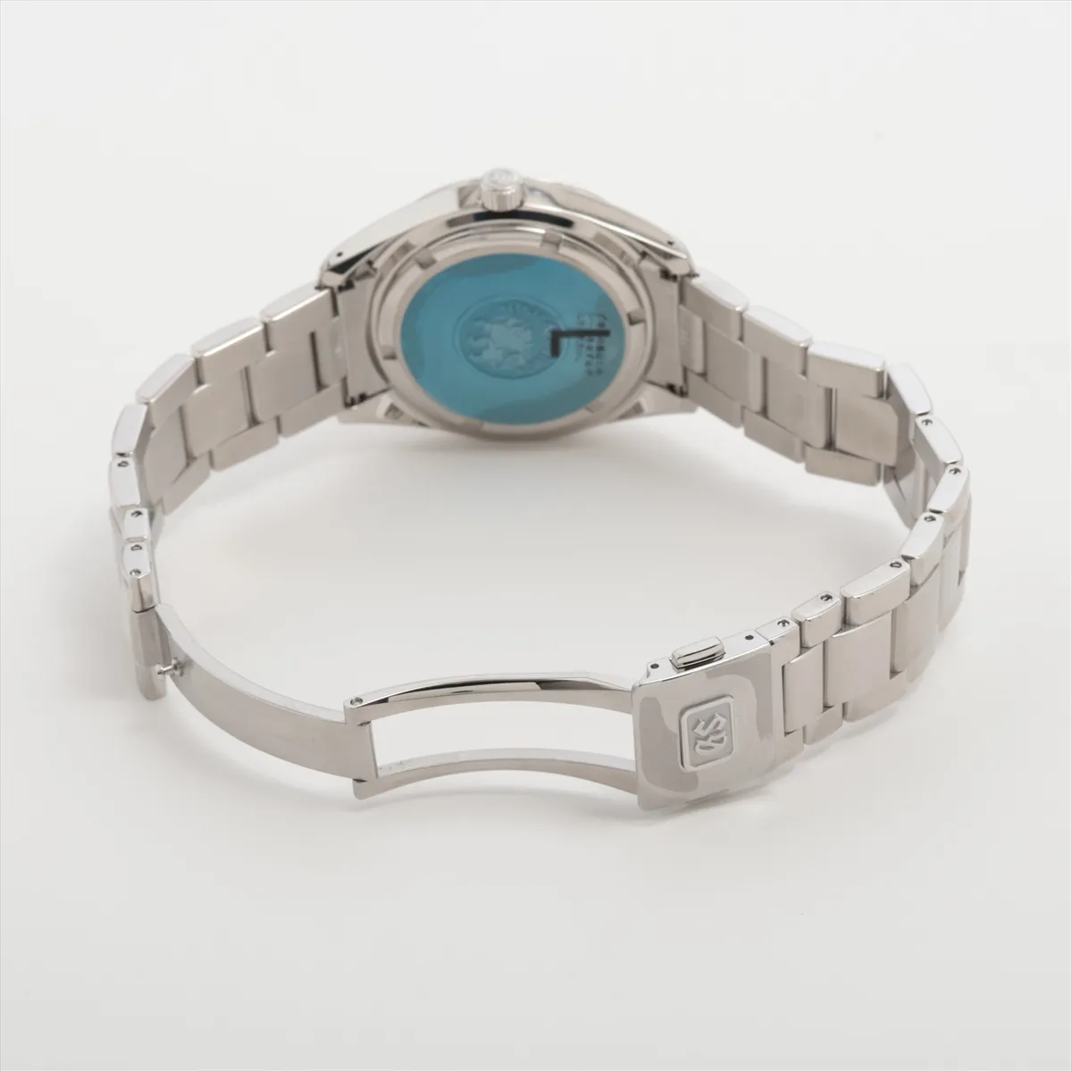 Steel wristwatch with blue dial, applied baton markers and steel bracelet.