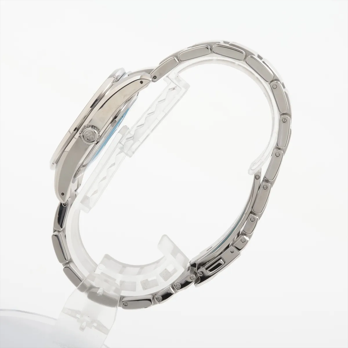 Steel wristwatch with blue dial, applied baton markers and steel bracelet.