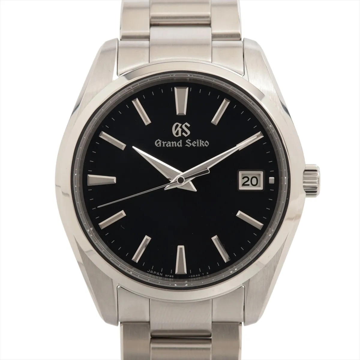 Steel wristwatch with blue dial, date aperture at three o'clock and brushed steel bracelet.