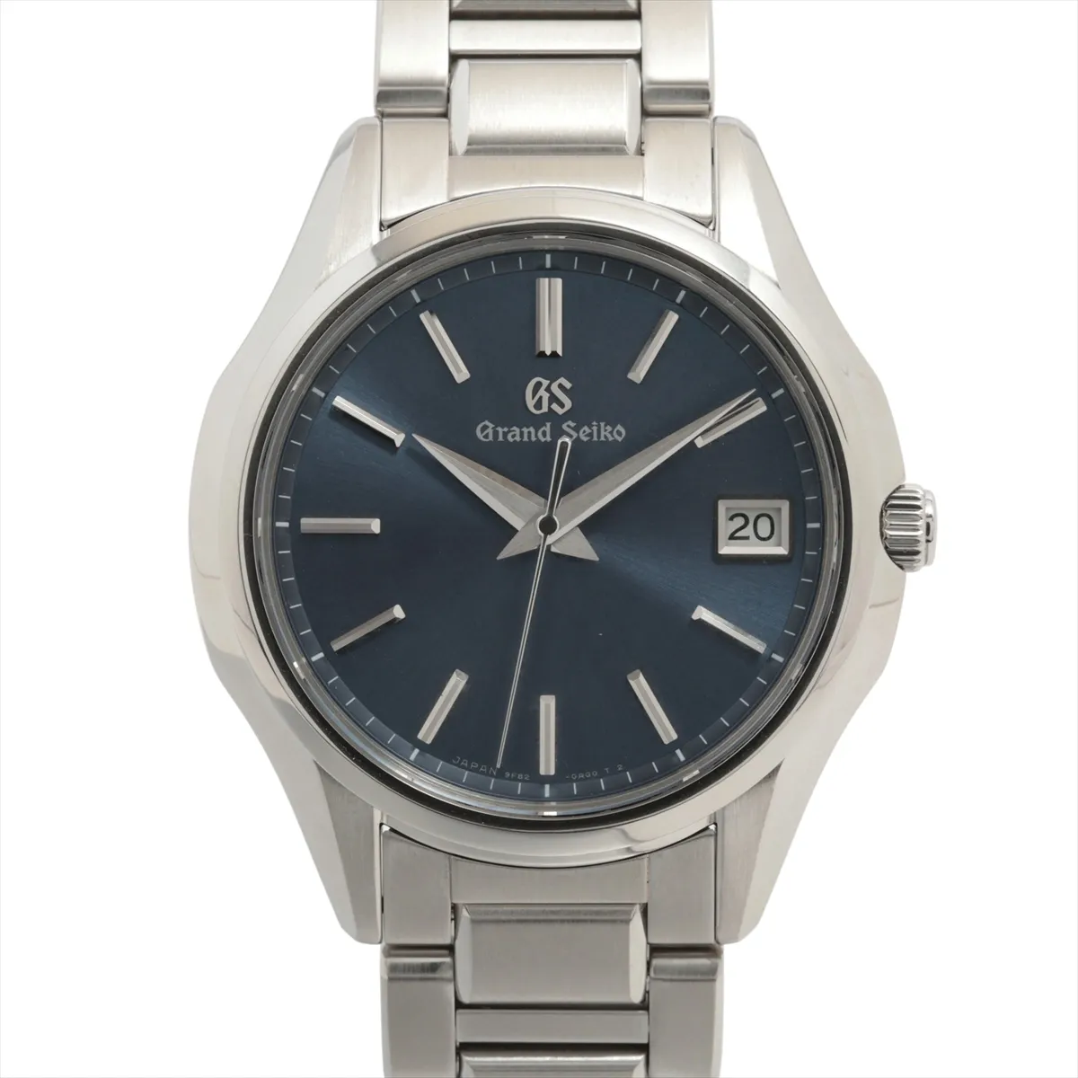 Steel wristwatch with deep blue dial, applied baton markers, date window and steel bracelet.