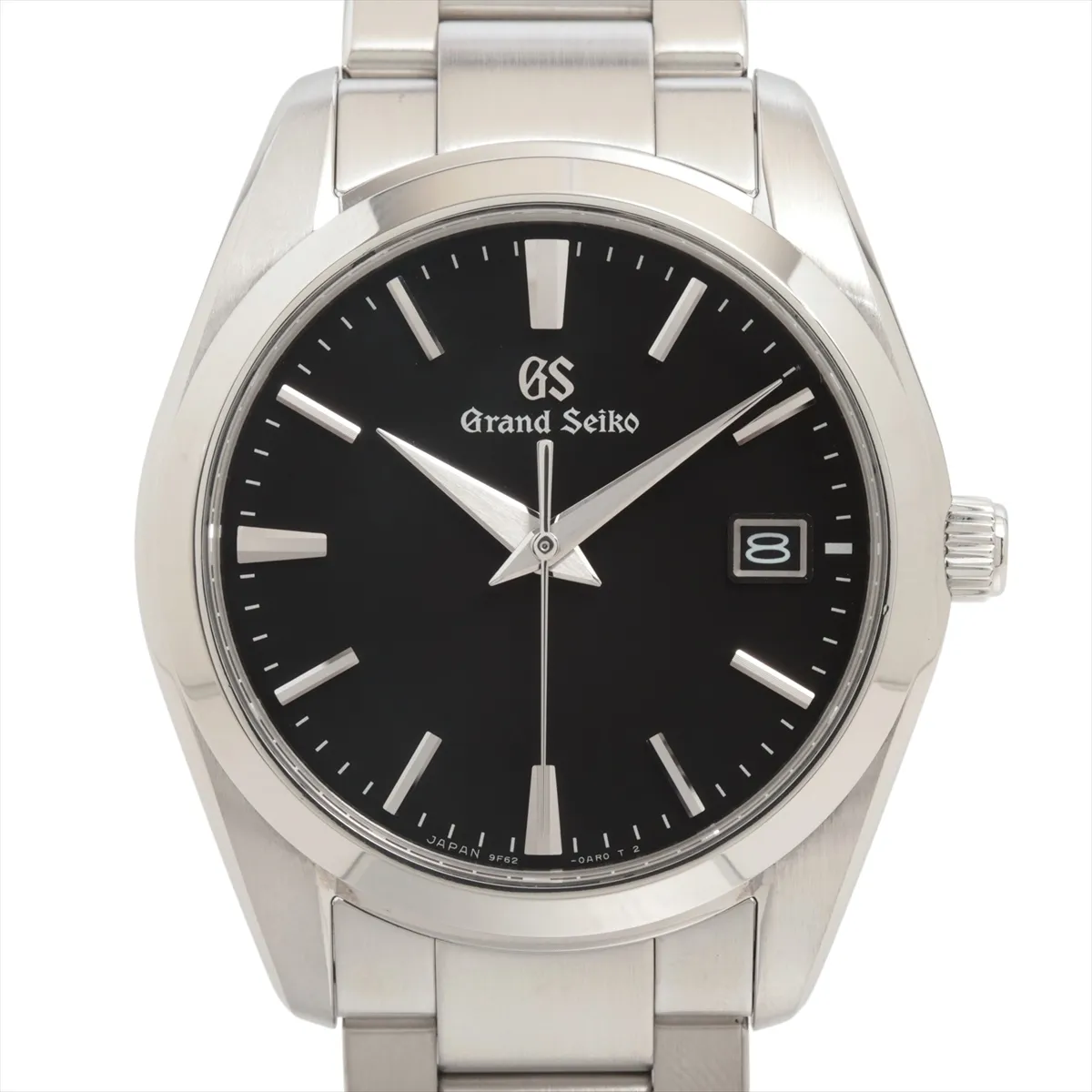 Steel wristwatch with black dial, baton indexes and matching steel bracelet.