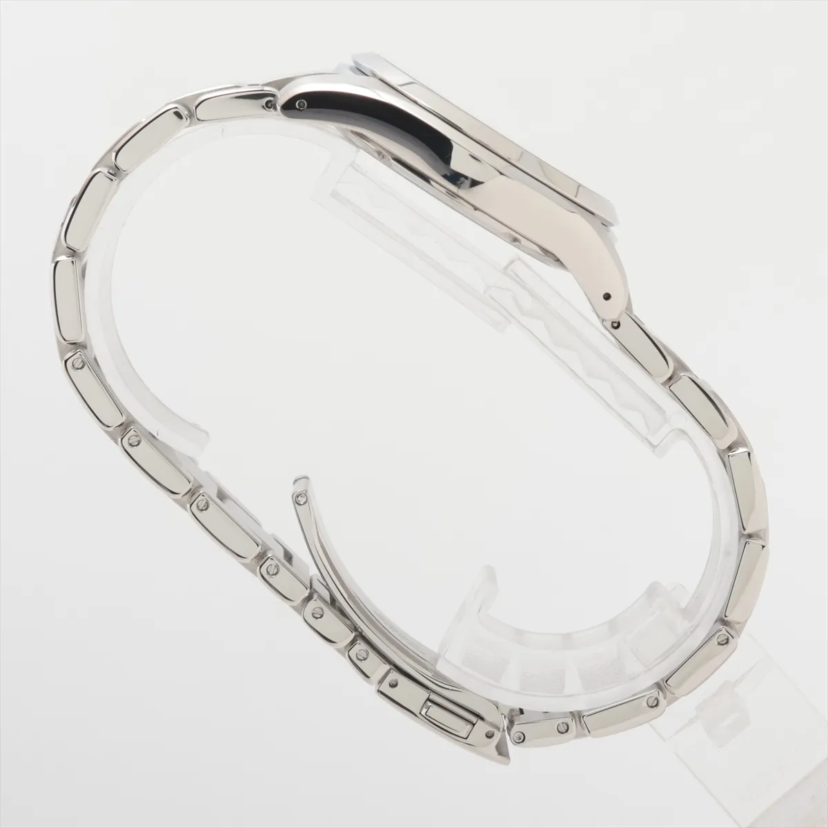 Steel wristwatch with black dial, baton indexes and matching steel bracelet.