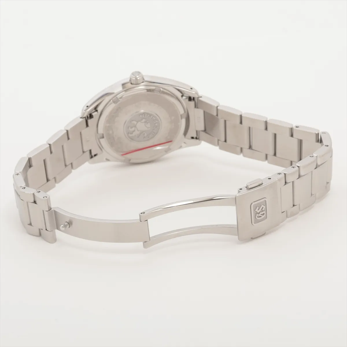 Steel bracelet watch with a black dial, baton markers and a date window at three o'clock.