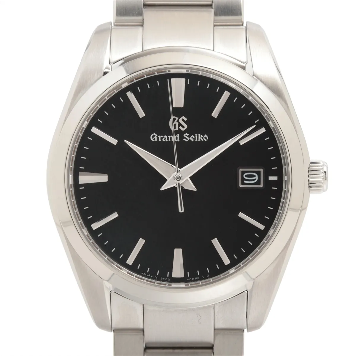 Steel wristwatch with black dial, baton markers and matching steel bracelet.