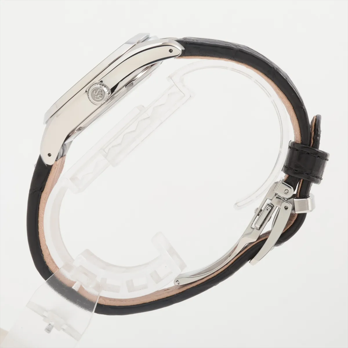 Product photograph of a round silver-dial watch on a leather strap.