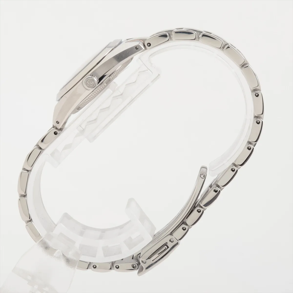 Slim steel watch with shimmering white dial and polished bracelet.