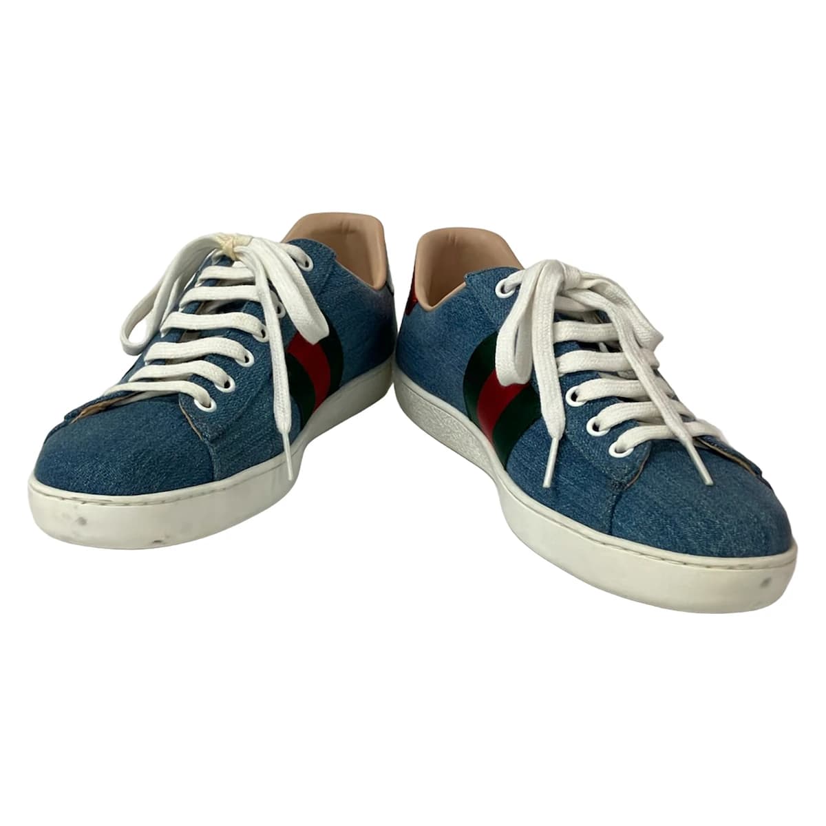 Pair of low-top shoes with floral embroidery across the upper, photographed against a plain background.
