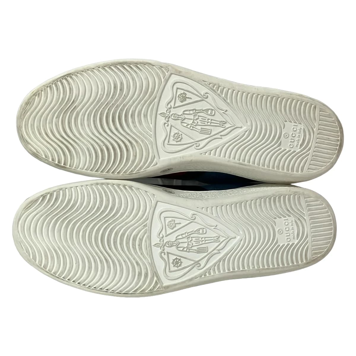Pair of low-top shoes with floral embroidery across the upper, photographed against a plain background.