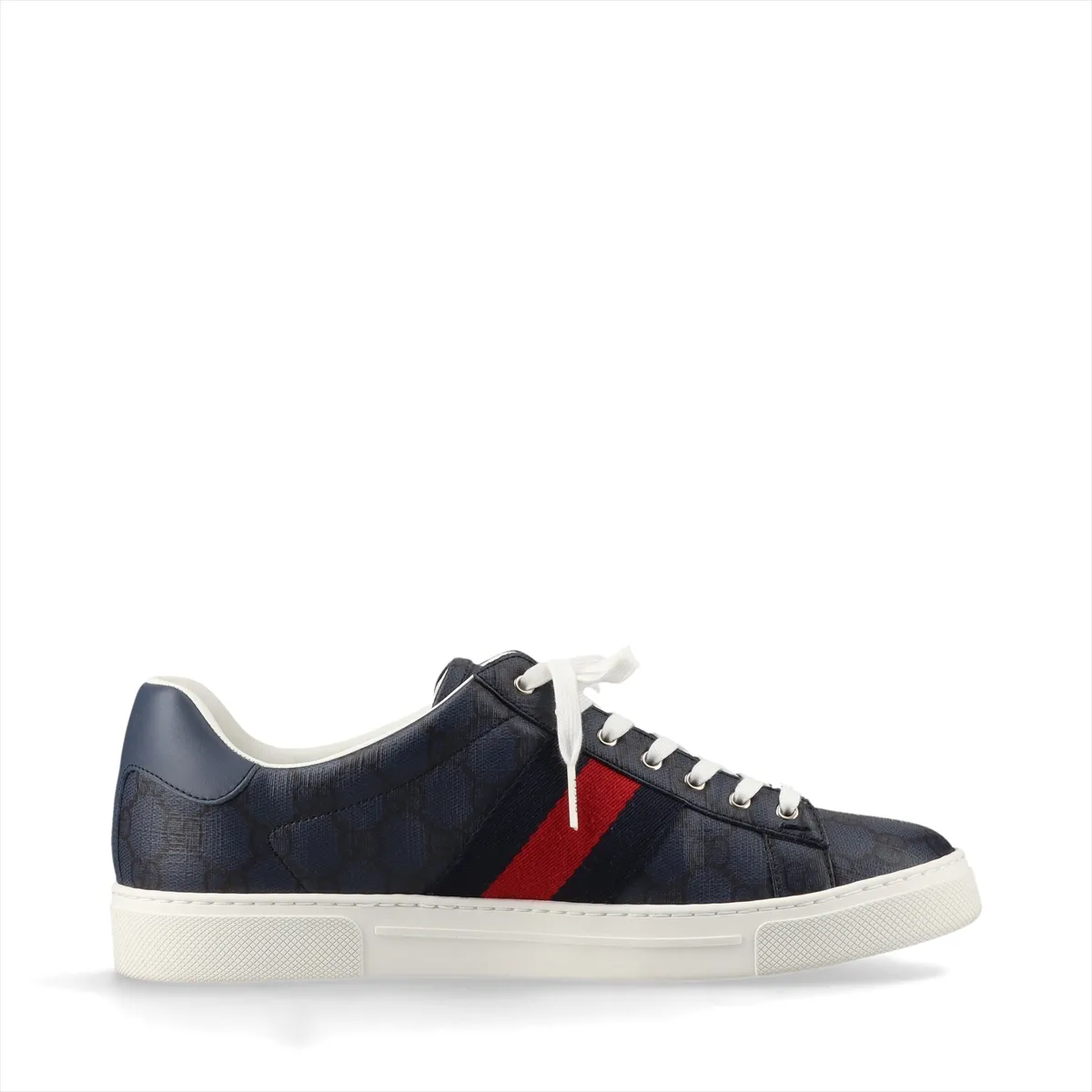 Pair of low-top navy sneakers with a red and green striped band and monogram-pattern panels.