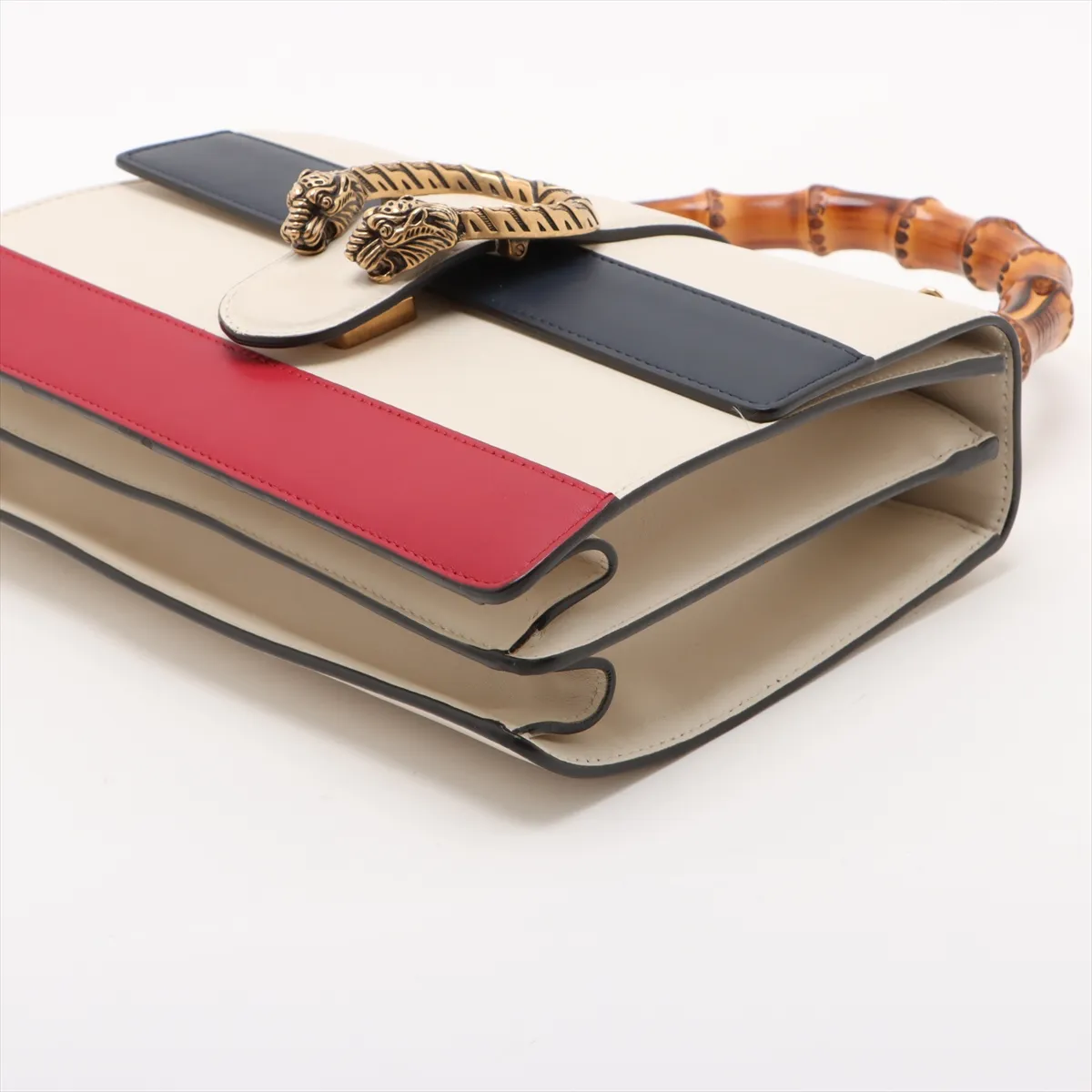 Multicolour leather handbag with bamboo-accented hardware, a top handle and a detachable strap.