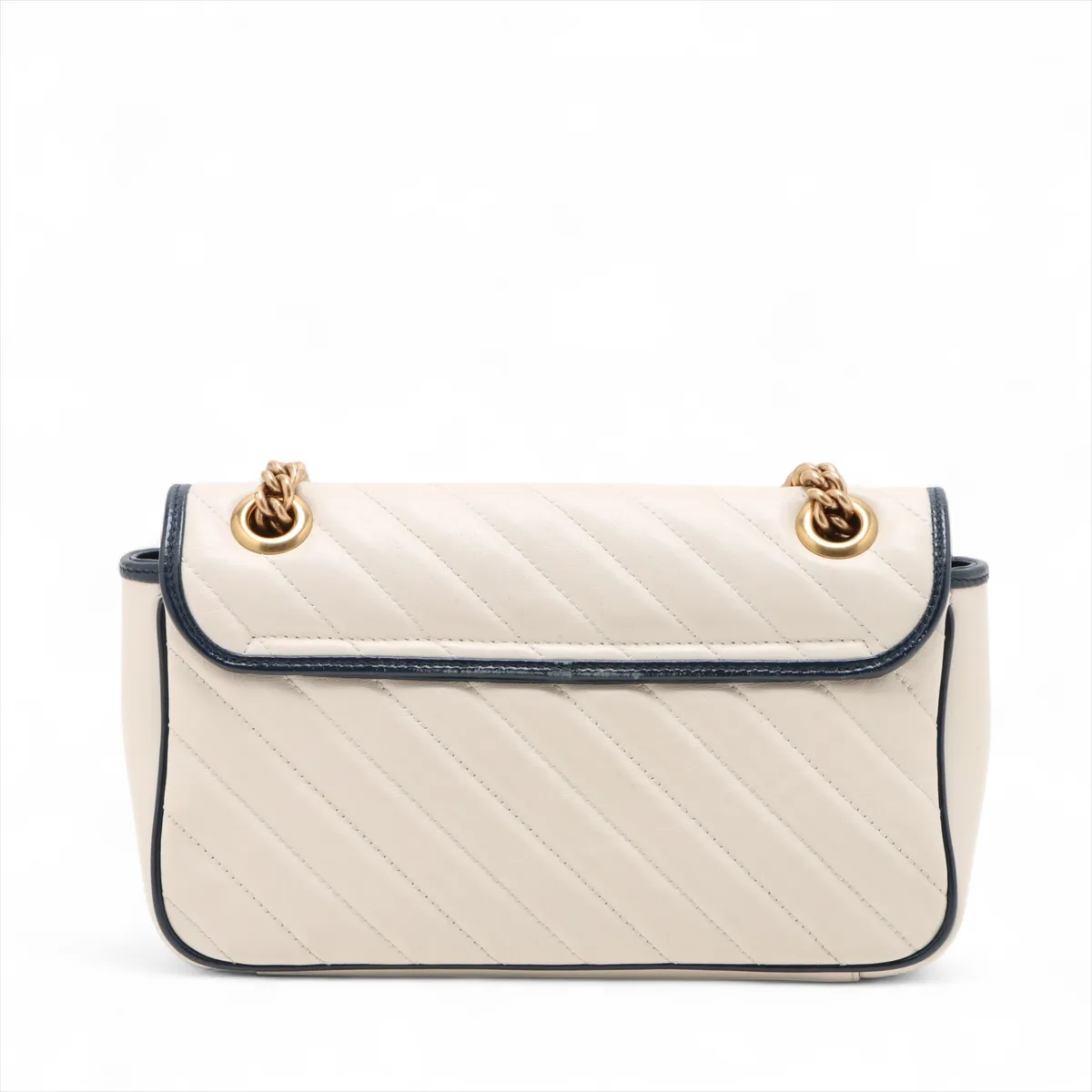 White chevron-quilted leather flap bag with navy trim, a double-G clasp and a chain strap.