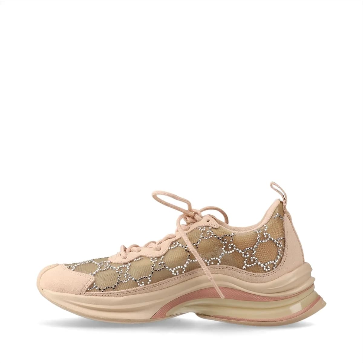 Low-top pink-beige suede and mesh trainers with sparkling stone detailing on the side.