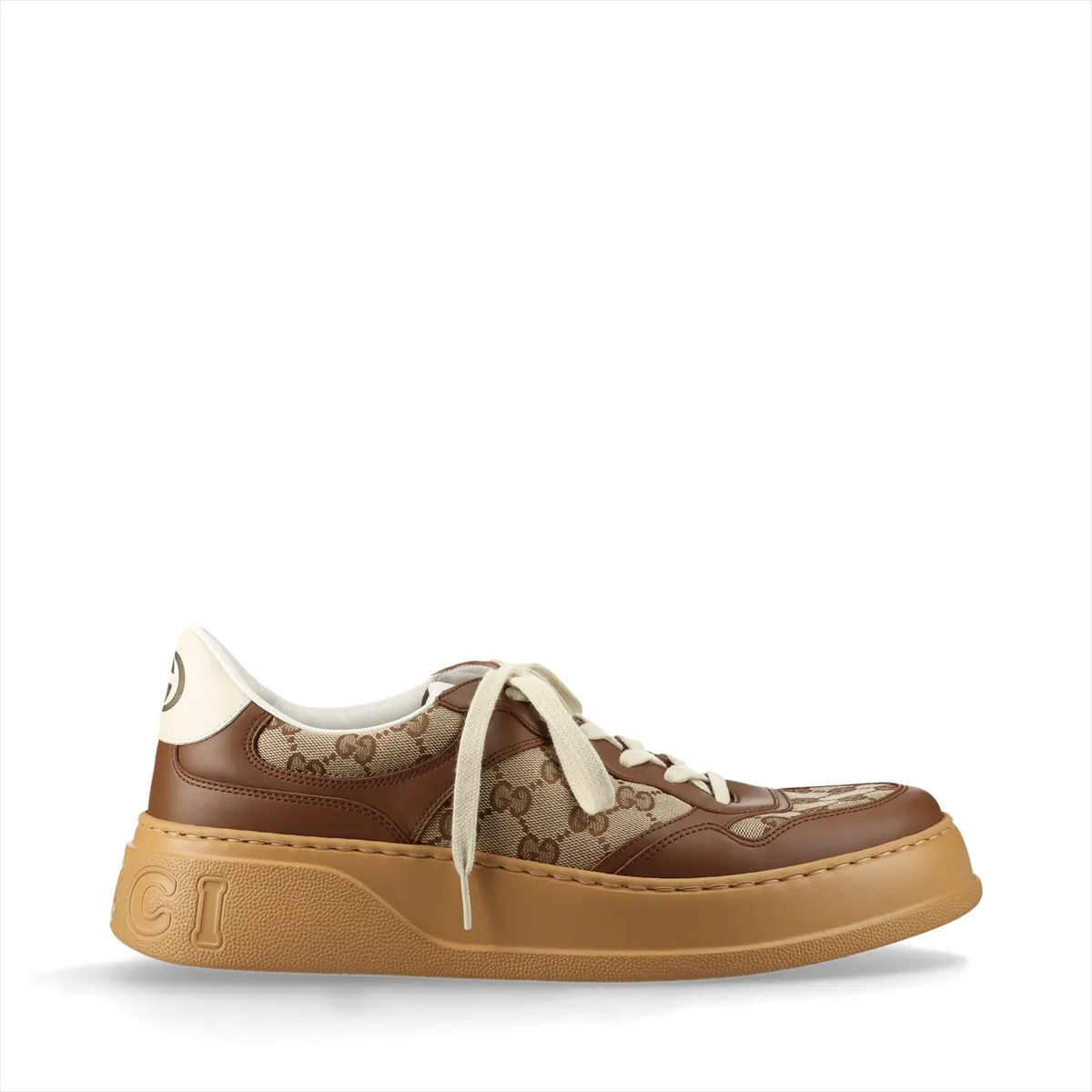Brown and beige monogram-patterned trainers with a thick raised sole.