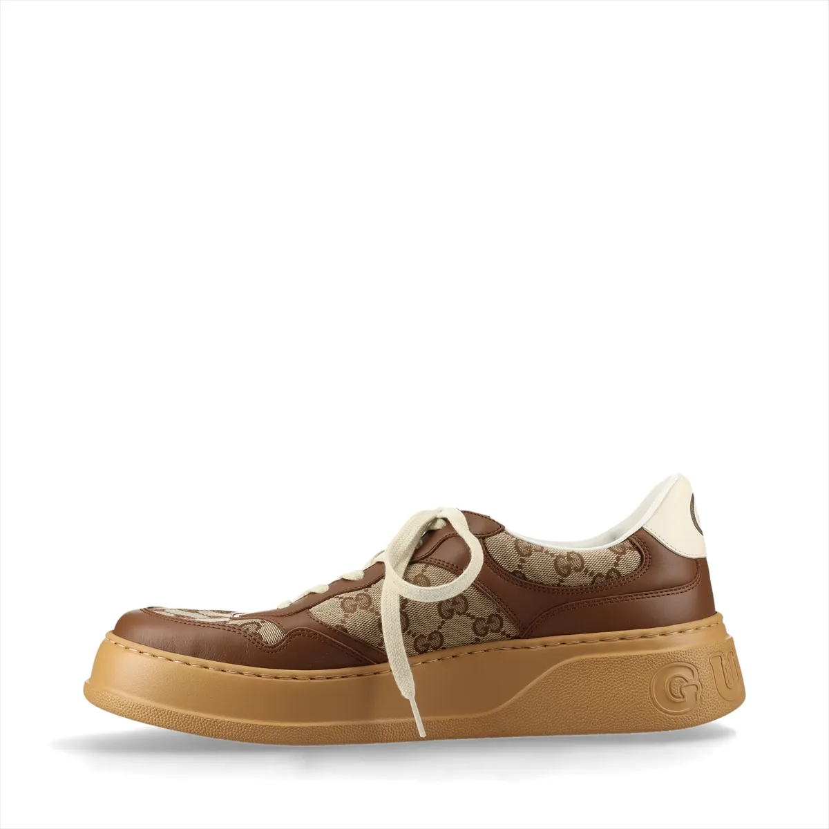 Brown and beige monogram-patterned trainers with a thick raised sole.