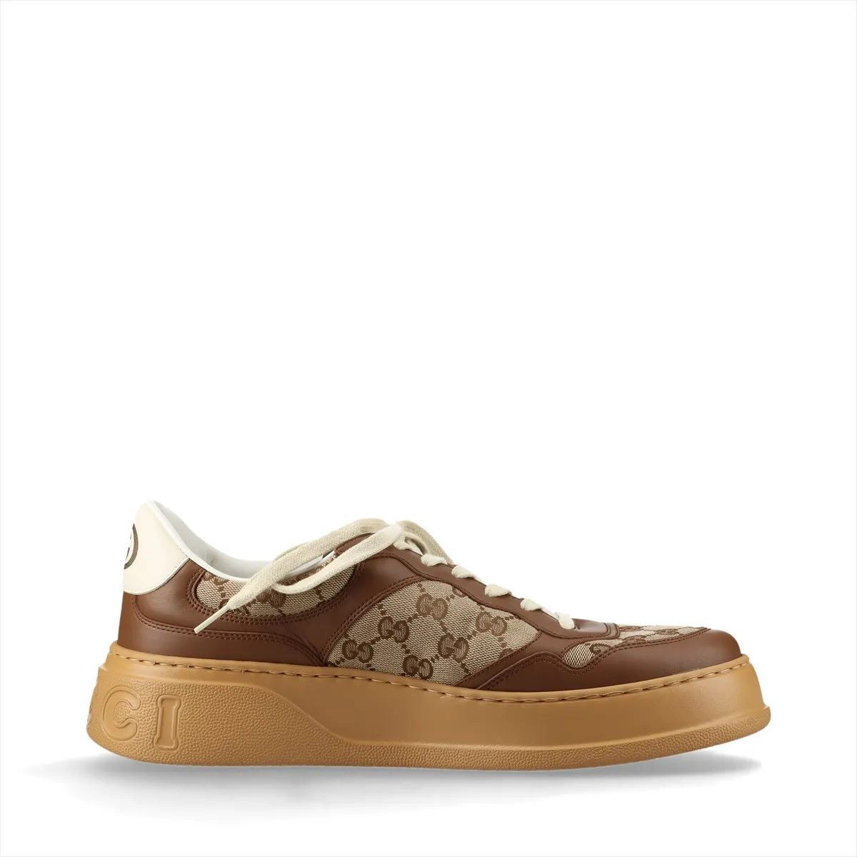 Brown and beige monogram-patterned trainers with a thick raised sole.