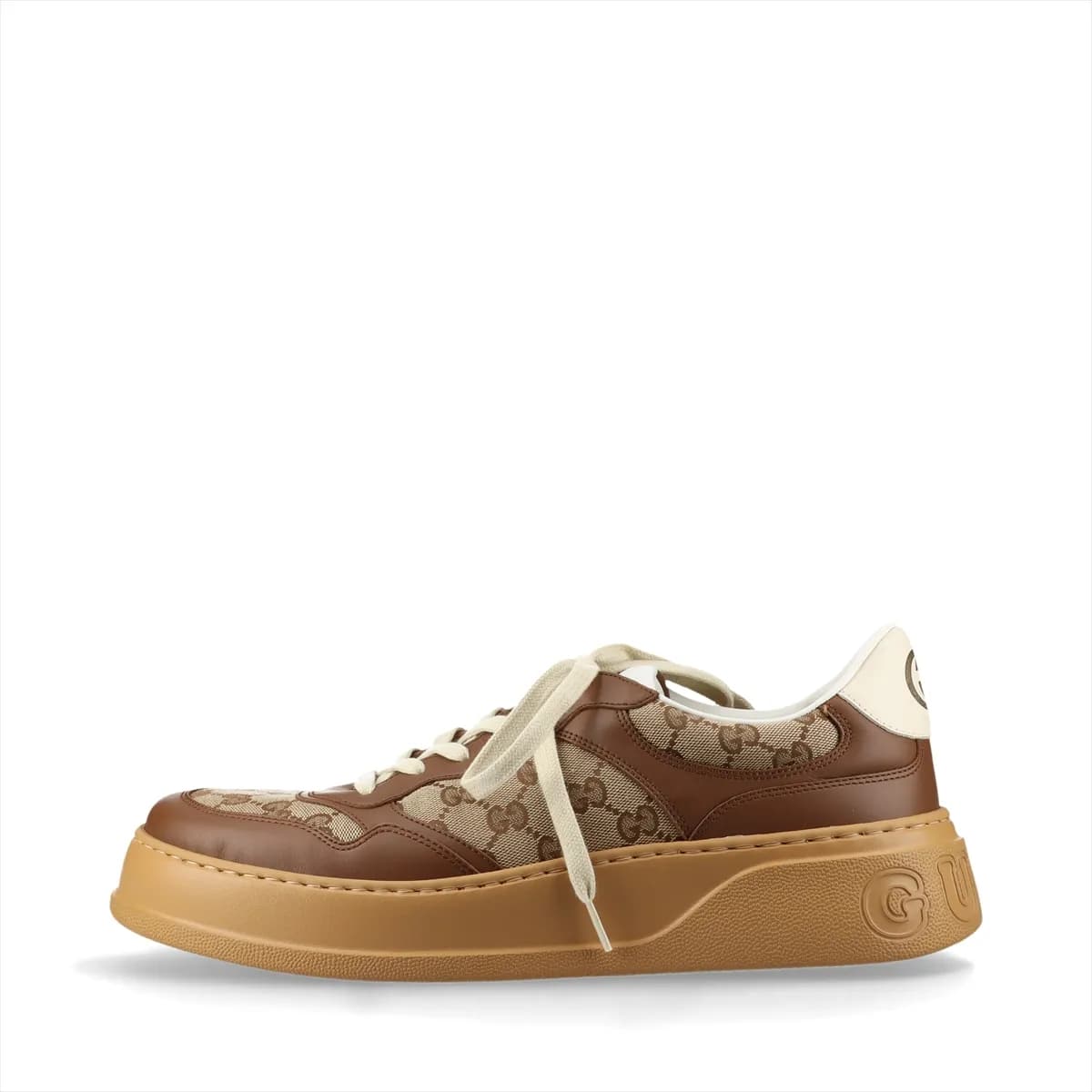 Brown and beige monogram-patterned trainers with a thick raised sole.