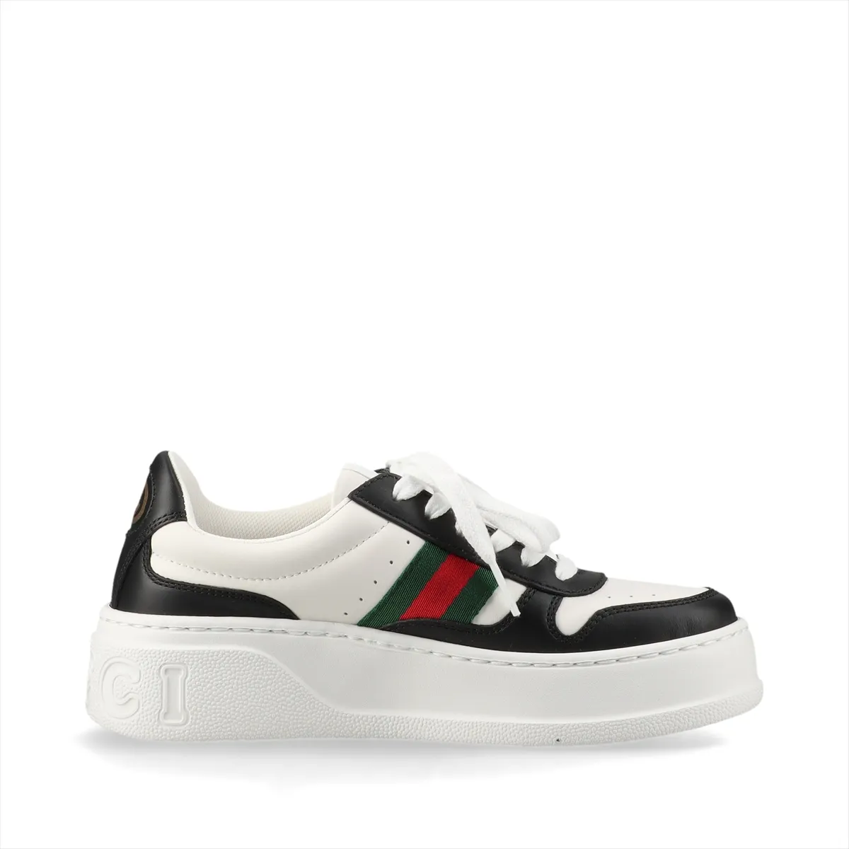 Pair of black and white platform lace-up sneakers with a striped band.