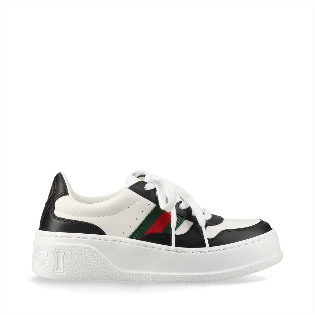 Pair of black and white platform lace-up sneakers with a striped band.