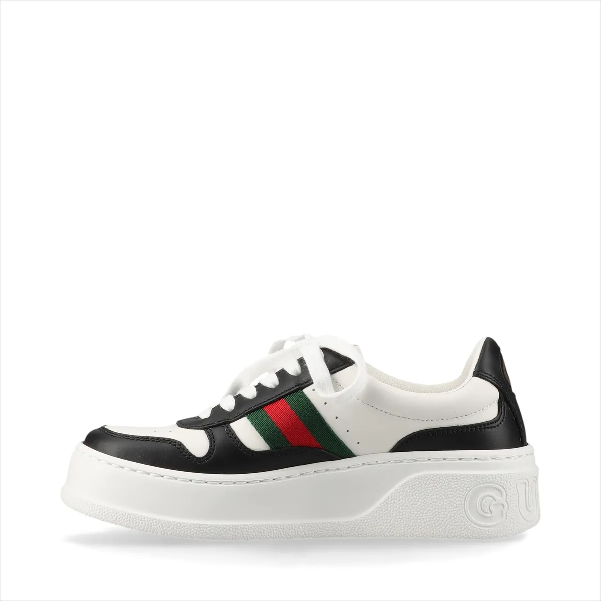 Pair of black and white platform lace-up sneakers with a striped band.