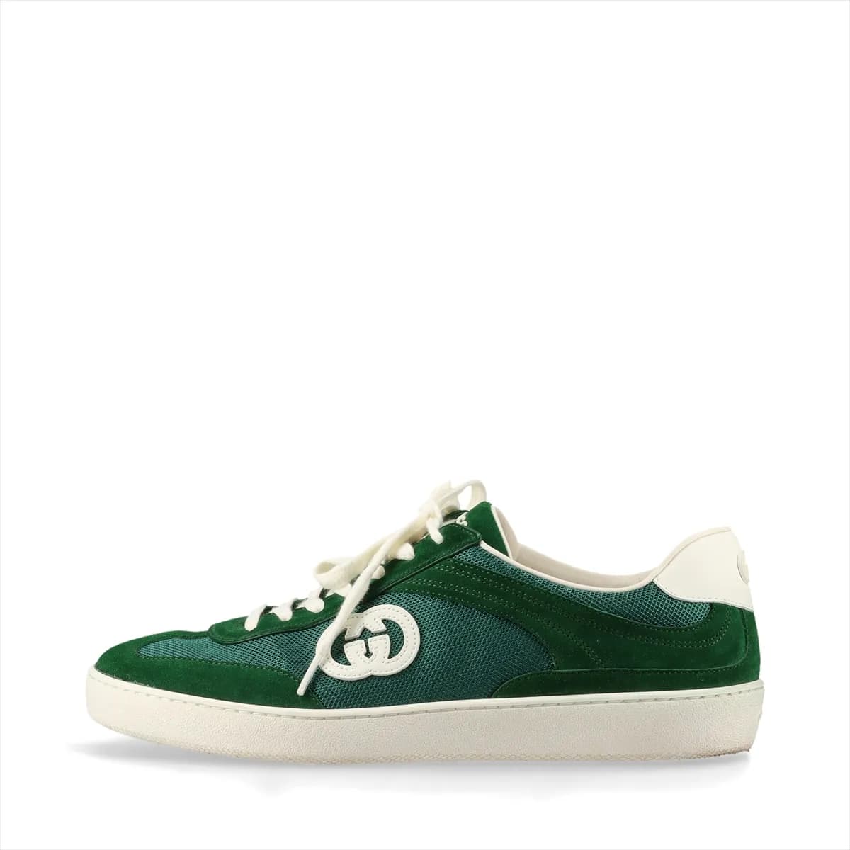 Green mesh and leather sneaker with a metal logo detail, shown in profile.
