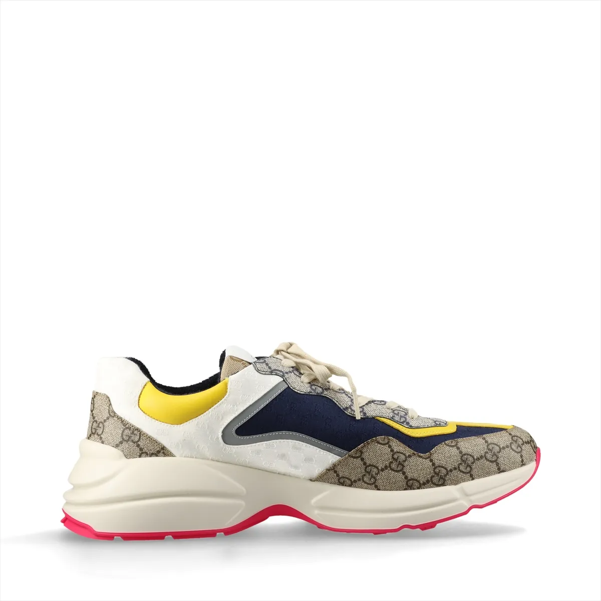 Pair of low-top multicolour patterned trainers with thick white soles, shown from the side.