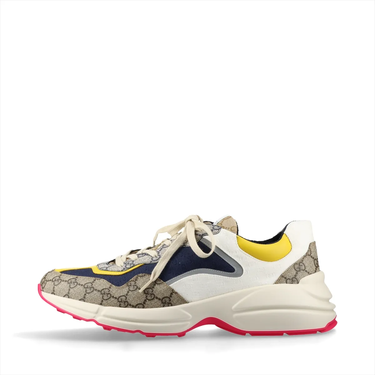 Pair of low-top multicolour patterned trainers with thick white soles, shown from the side.