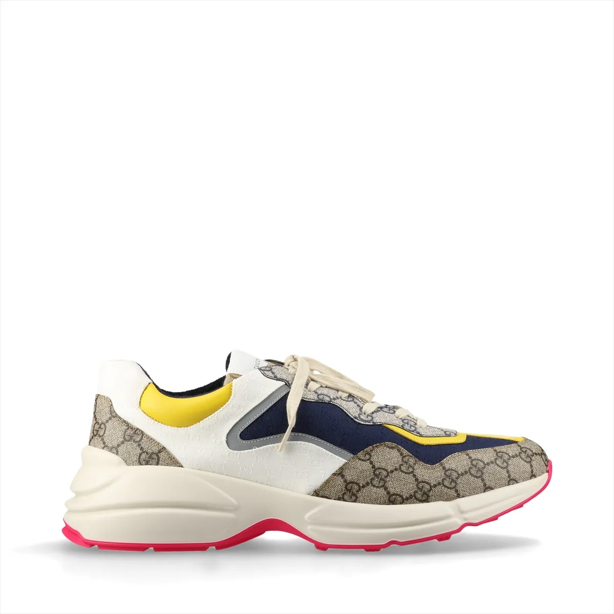 Pair of low-top multicolour patterned trainers with thick white soles, shown from the side.