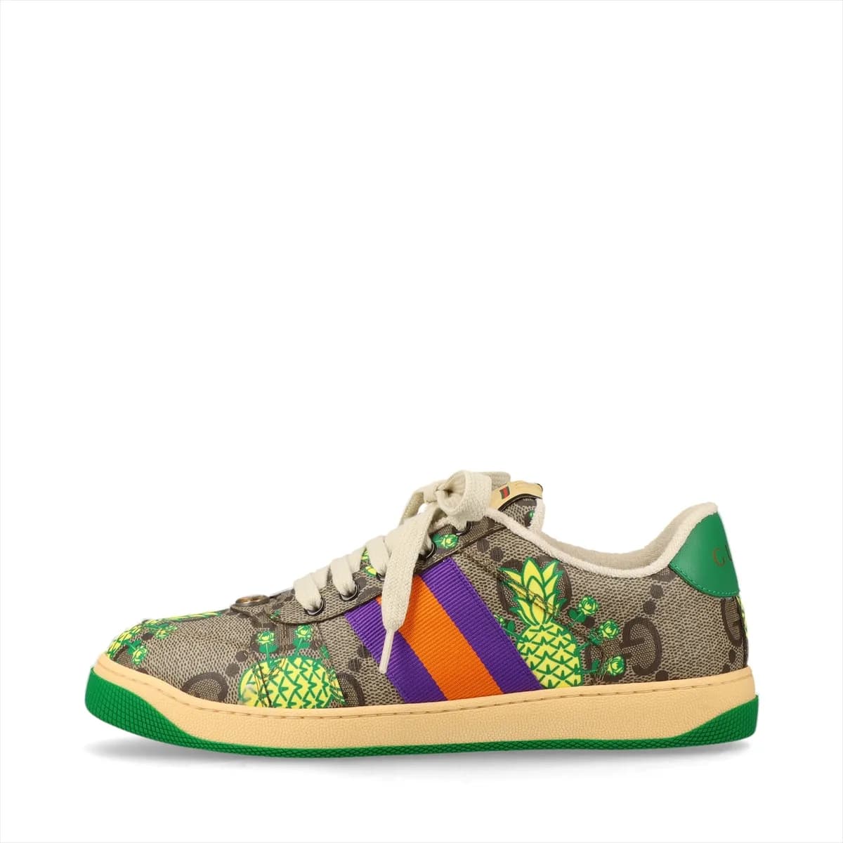 Brown patterned low-top sneakers with printed motifs, white striped trim and off-white soles.