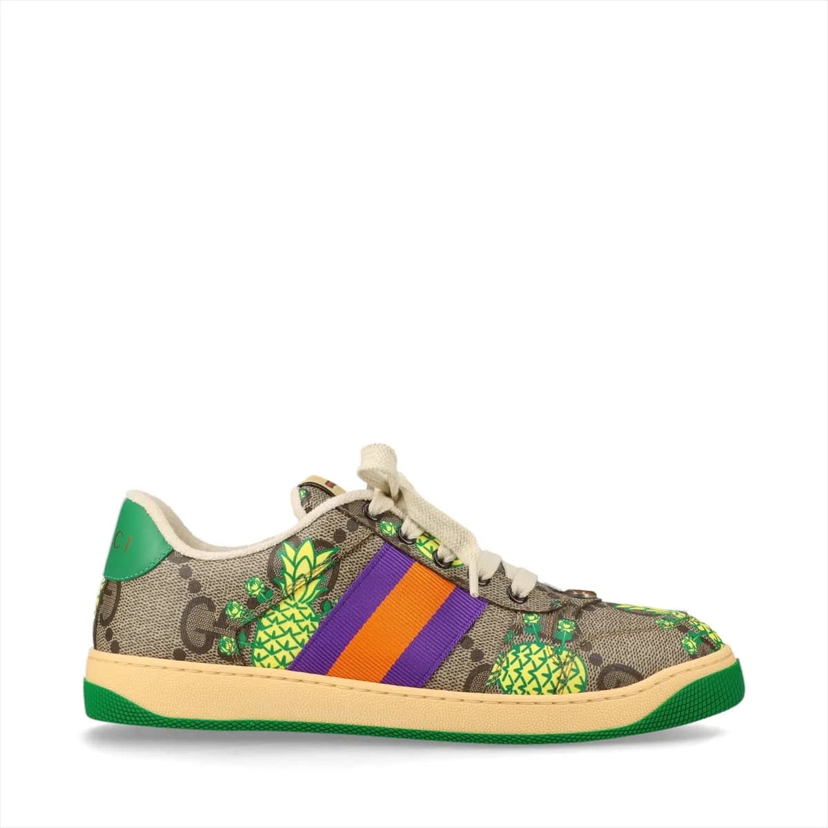 Brown patterned low-top sneakers with printed motifs, white striped trim and off-white soles.