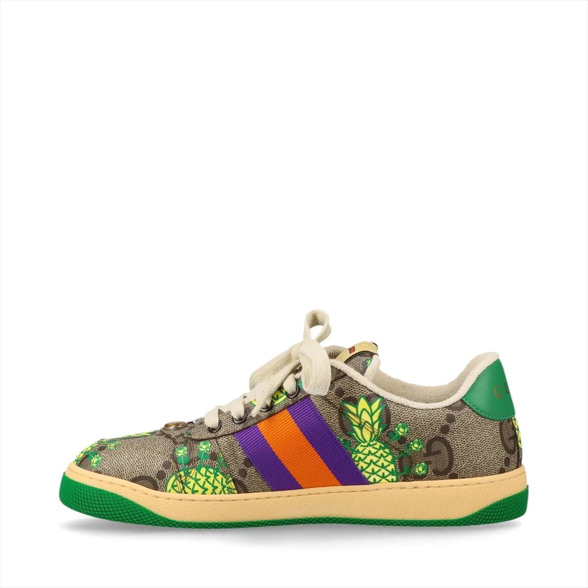 Brown patterned low-top sneakers with printed motifs, white striped trim and off-white soles.