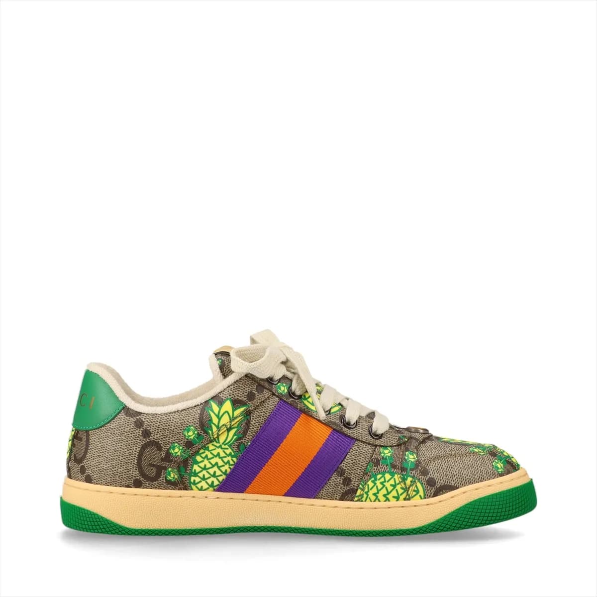 Brown patterned low-top sneakers with printed motifs, white striped trim and off-white soles.