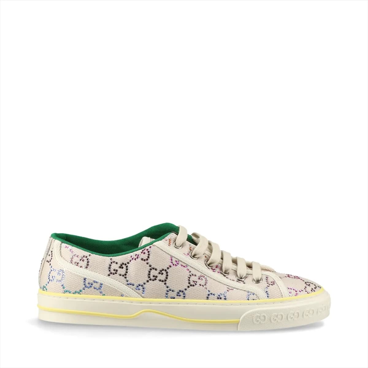 Ivory canvas low-top sneaker with woven stripe and sparkling stones along the heel.