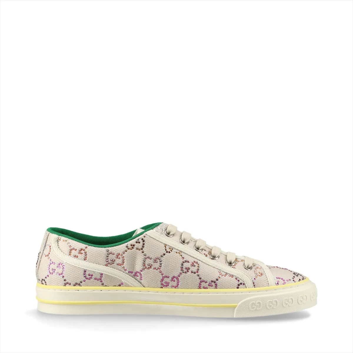 Ivory canvas low-top sneaker with woven stripe and sparkling stones along the heel.